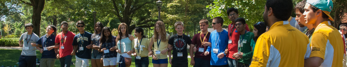 A group of GT students embracing while forming a semicircle.