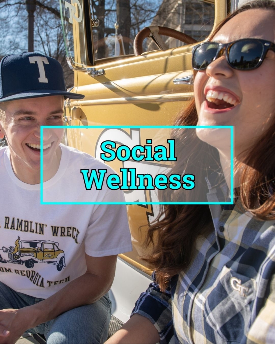 Image of two students laughing together outside with text that reads "Social Wellness"